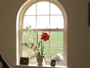 Arched sliding sash window