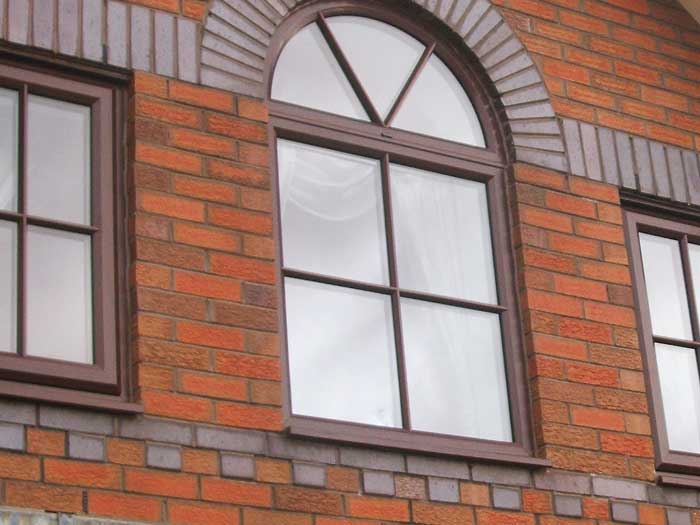 Curved window in brown uPVC