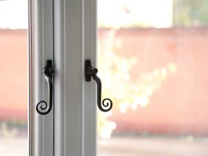 Timber look uPVC windows with traditional handles-heritage look