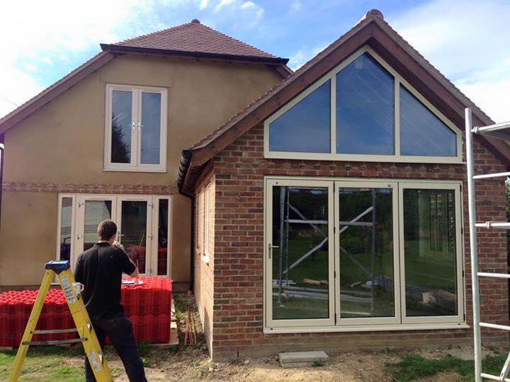 Raked window and aluminium bifold doors