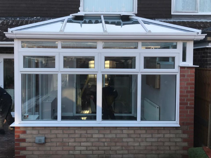 White Upvc conservatory with brickwork