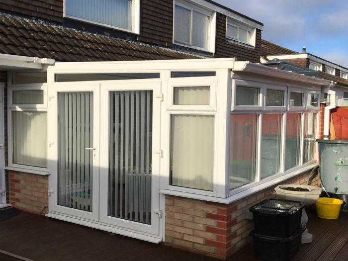 White upvc conservatory installation with doors