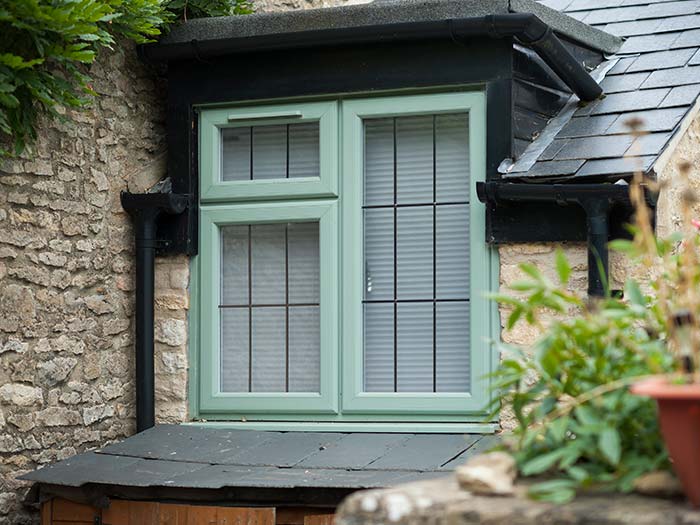 Chartwell green uPVC window with traditional lead detail