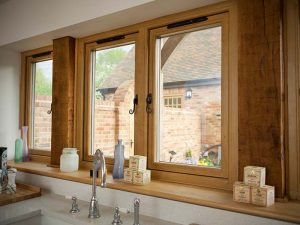 Oak effect residence 9 windows with a view out from kitchen onto the garden