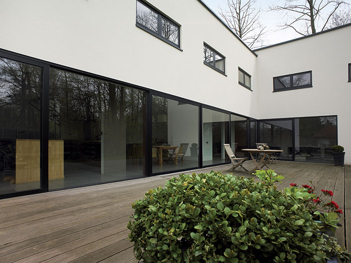 Contemporary black aluminium patio doors on modern white home
