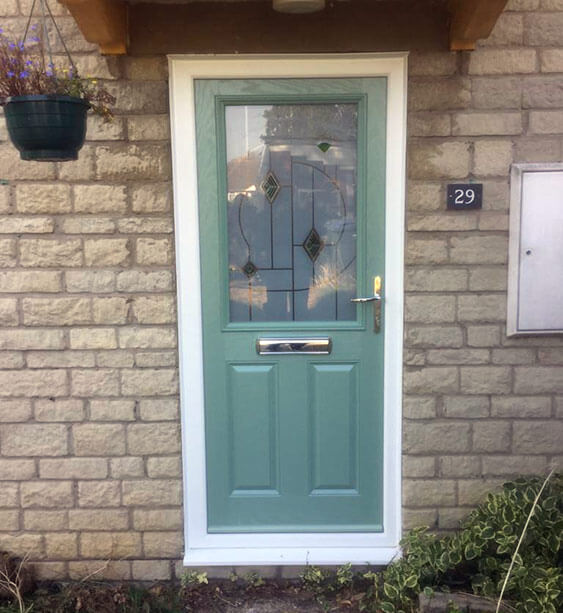 Chartwell green composite door with chrome letterbox and handle