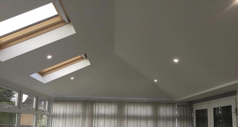 white roof extension with skylights