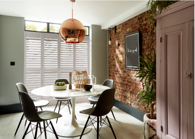 White shutters in dining room.