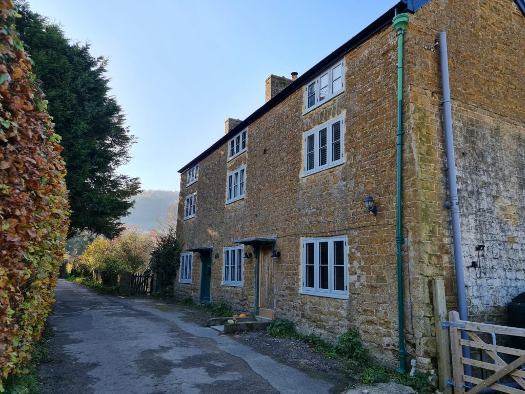 Old stone cottages with new flush sash windows.