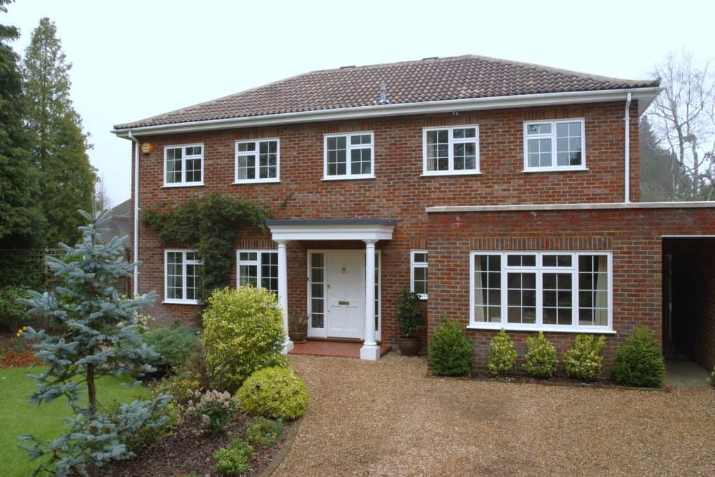 White uPVC windows on a brick house.