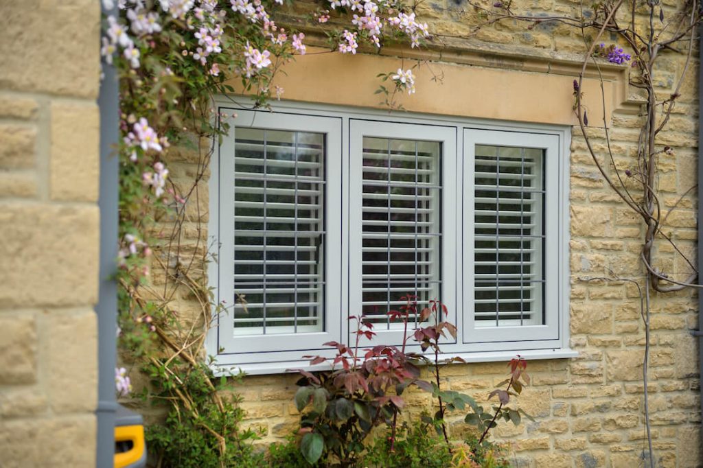 flush sash window with plantation shutters installed in Swindon.